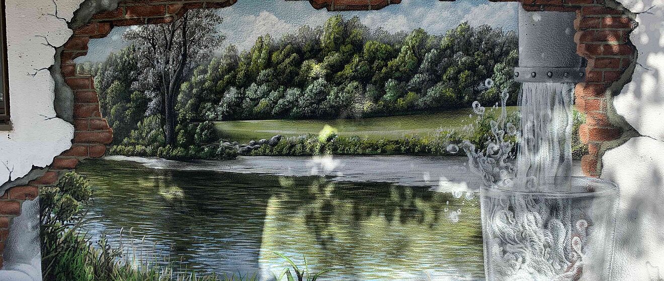 Graffiti zum Thema Trinkwasser auf Hauswand