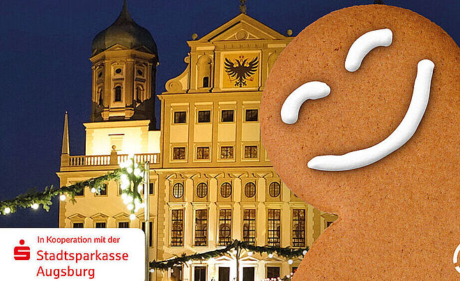 Lachender Lebkuchen vor dem Rathaus in Augsburg. Links ist das Logo der Sparkasse und rechts das Logo der swa
